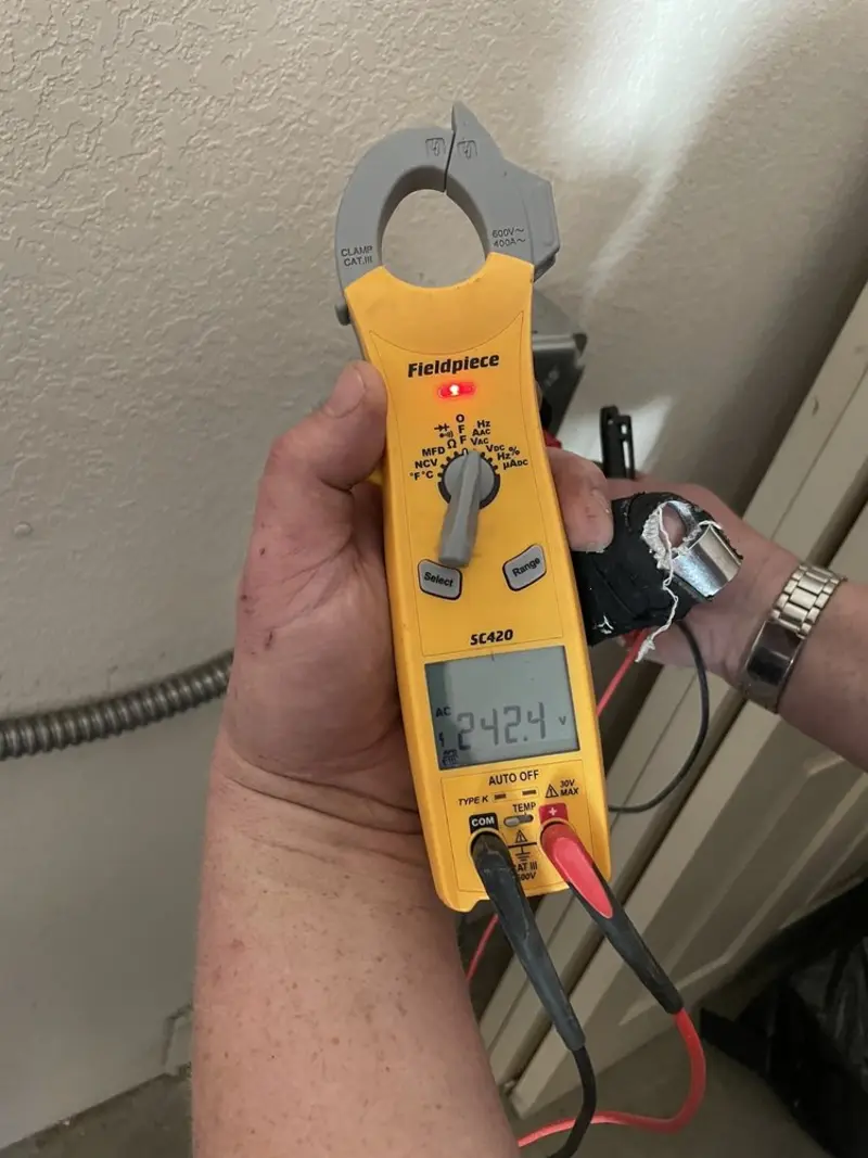 Voltage testing with clamp meter during Ceiling Fan Installation in Kingsville